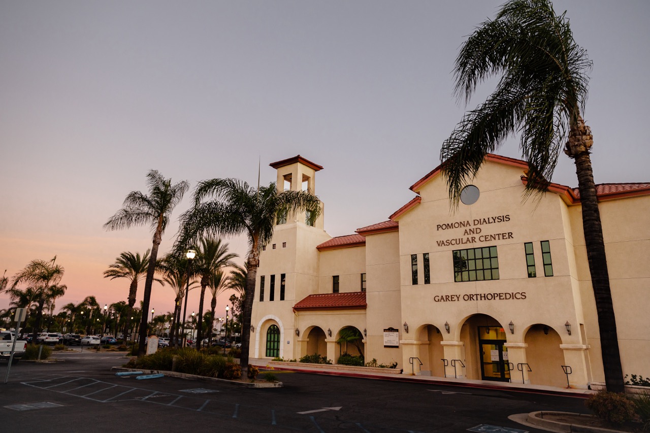 The building where Garey Orthopedic operates, with palm trees and Garey Orthopedics signage.
